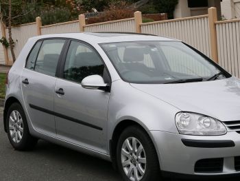 blue vw gold hatch with a 3 bike rack fitted 