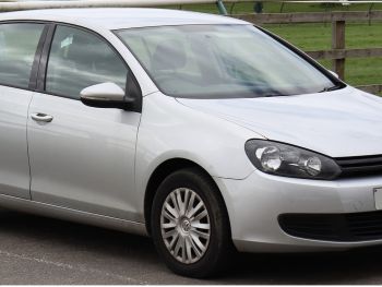 blue vw gold hatch with a 3 bike rack fitted 